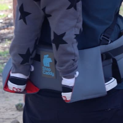Feature focus of Step Caddy child carrier - easy use ergonomics - stirrups to secure the child's feet